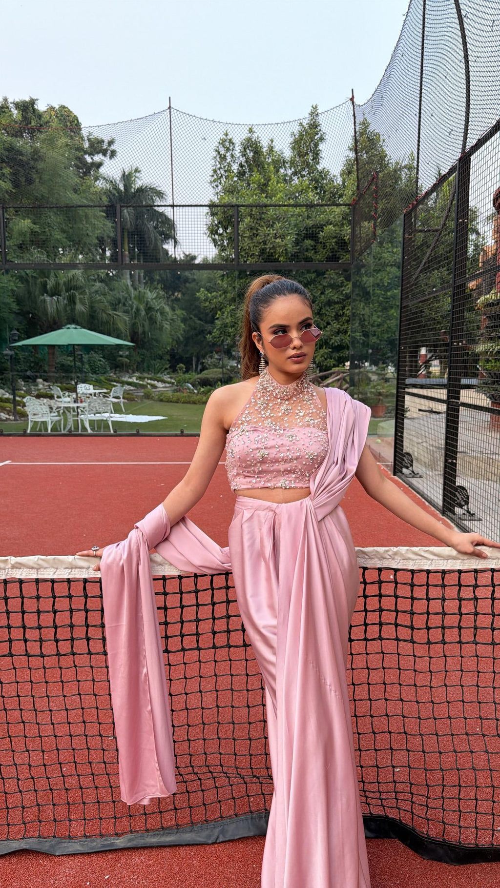 Soft Pink silk draped saree with a halter-neck 3D hand-embroidered blouse accented with crystals