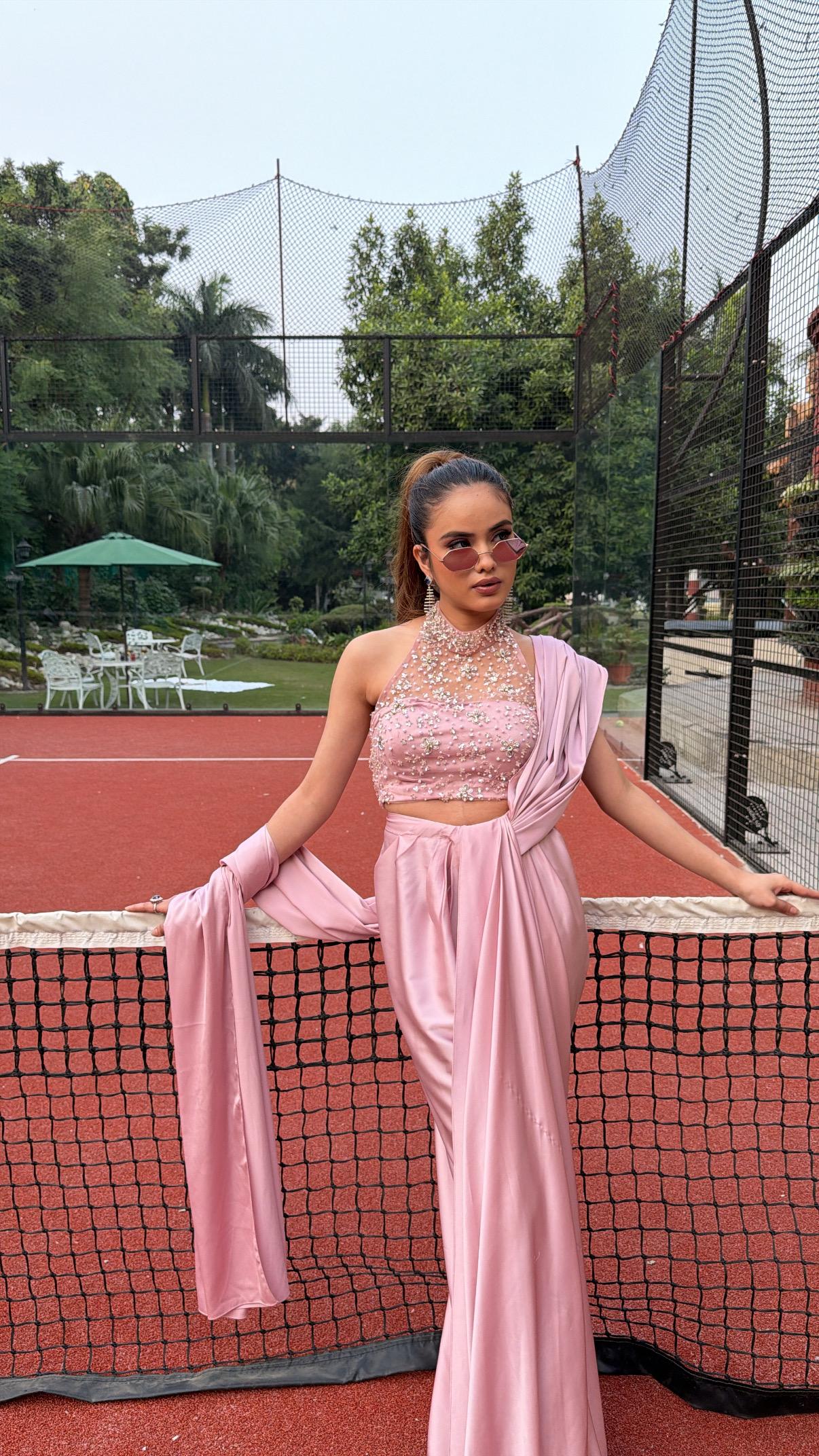 Soft Pink silk draped saree with a halter-neck 3D hand-embroidered blouse accented with crystals