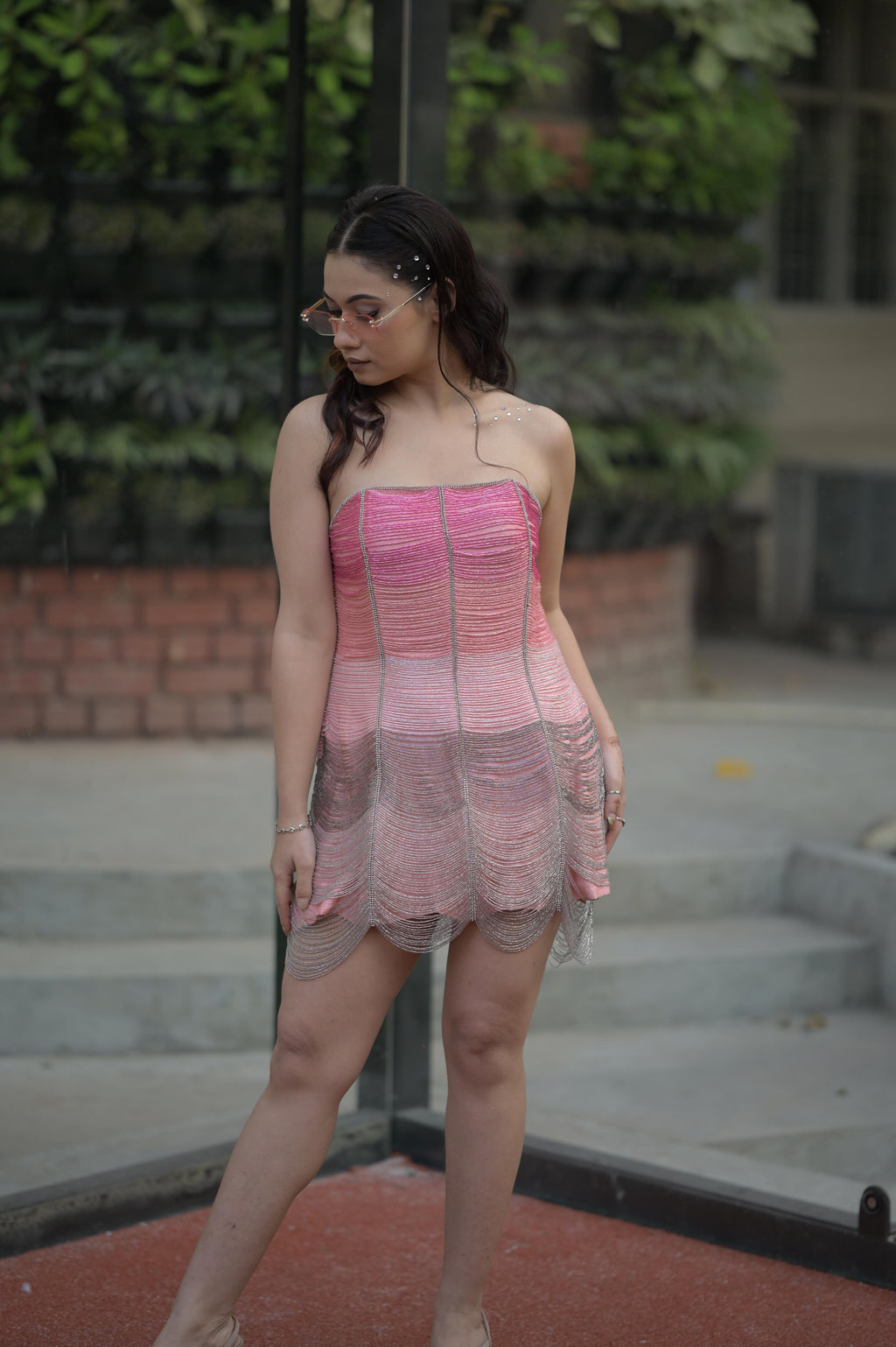 Pink-shaded hand-embroidered tube corset paired with a raw silk skirt