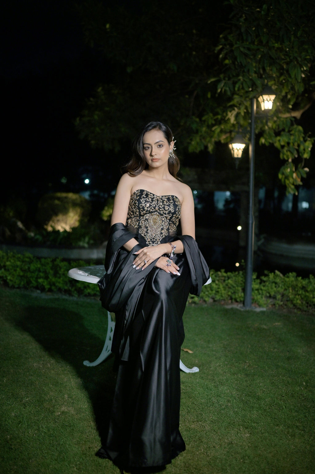 Hand-embroidered corset blouse with intricate detailing, paired with a draped saree